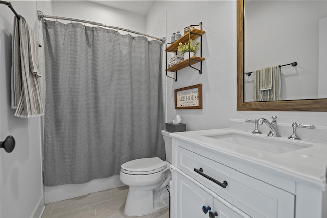 bathroom featuring toilet, tile patterned floors, shower / bath combination with curtain, and vanity