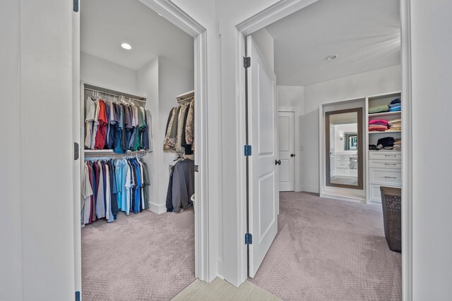 hallway featuring carpet floors and recessed lighting