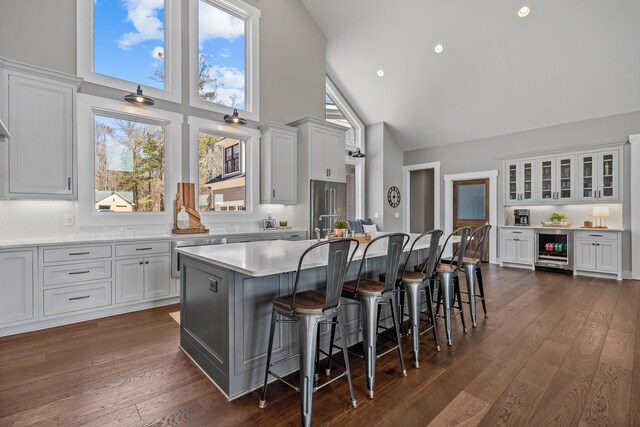 kitchen featuring dark wood-style floors, beverage cooler, white cabinets, and high end refrigerator