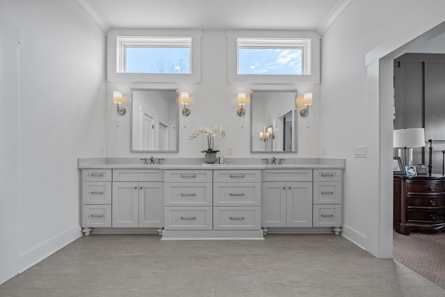 full bathroom with double vanity, plenty of natural light, and a sink