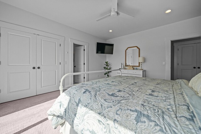 bedroom featuring carpet, a ceiling fan, a closet, and recessed lighting