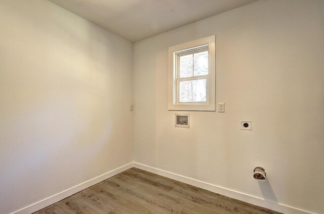 unfurnished living room featuring ceiling fan, a fireplace, and light hardwood / wood-style flooring