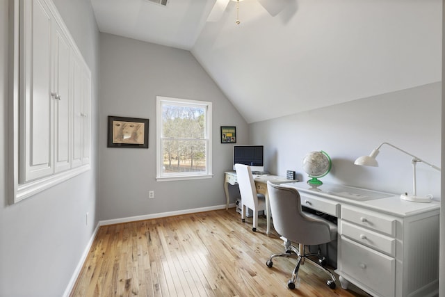 office featuring light wood-style floors, vaulted ceiling, baseboards, and ceiling fan