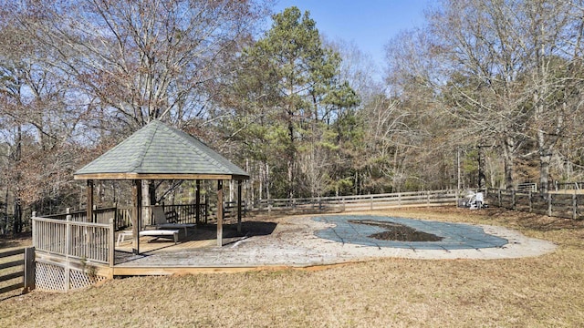 surrounding community with fence and a gazebo