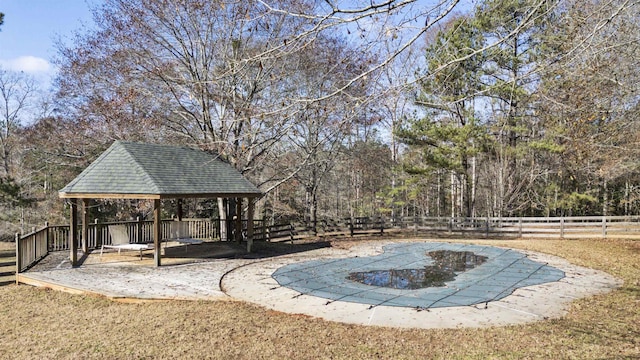 view of pool featuring a gazebo and fence