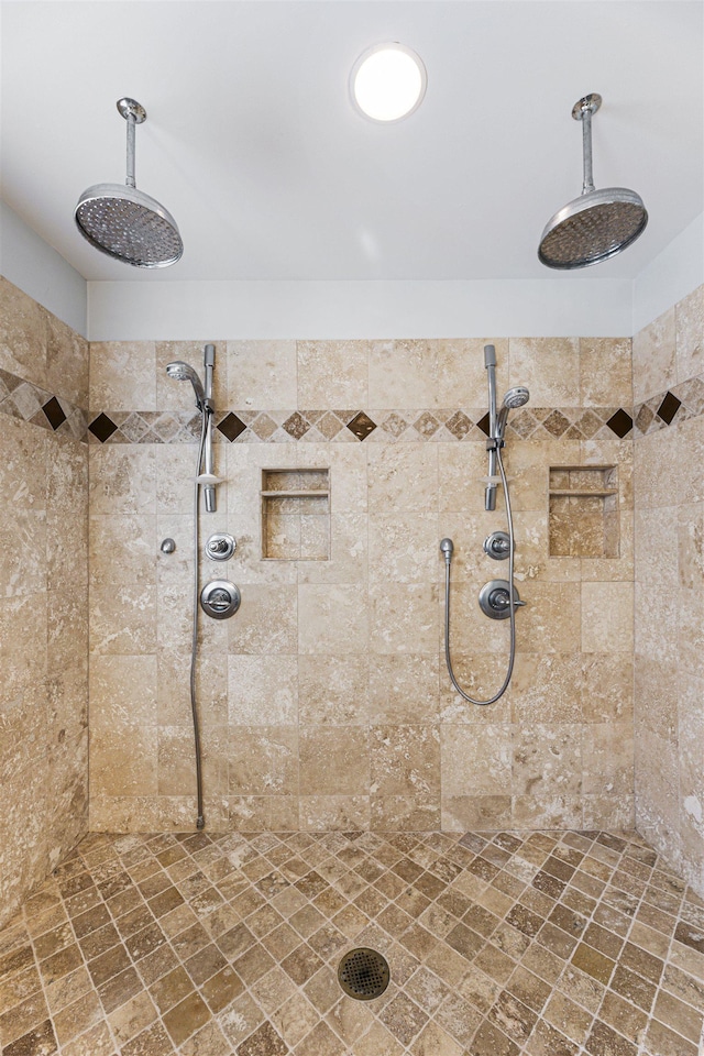 bathroom featuring a tile shower