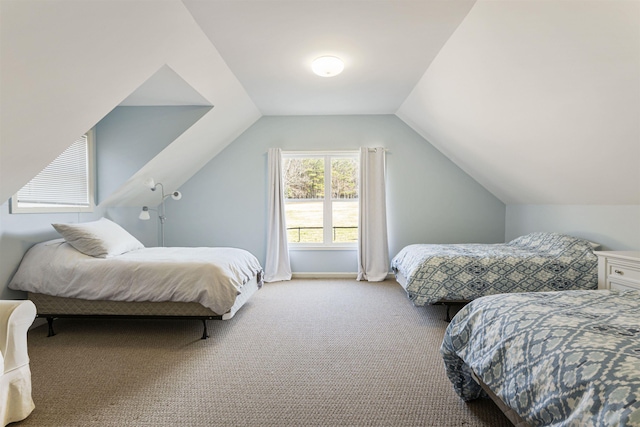 bedroom with carpet floors and vaulted ceiling