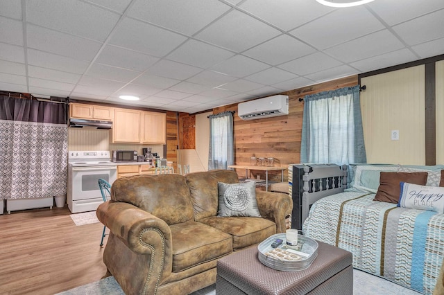 160 Rockville Springs Dr, Eatonton, GA 31024 - living area featuring a paneled ceiling, light wood finished floors, wooden walls, and an AC wall unit