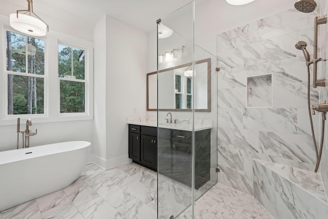 bathroom with a freestanding tub, vanity, marble finish floor, and a shower stall