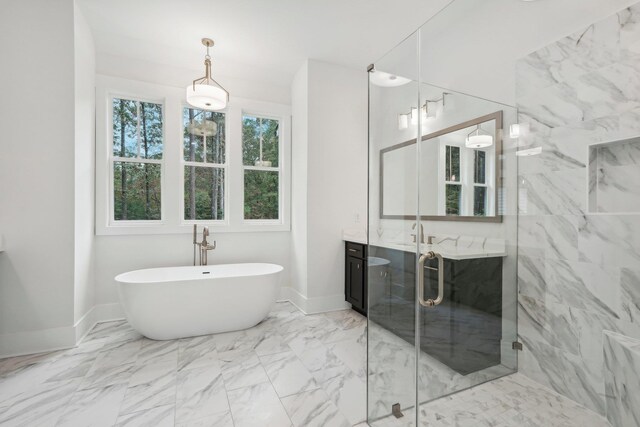 full bath featuring vanity, a soaking tub, marble finish floor, and a stall shower