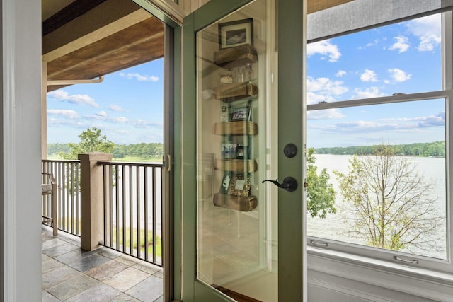 entryway featuring a water view