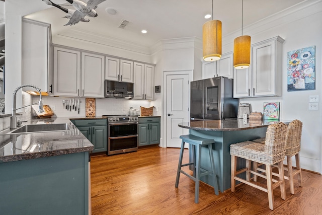 kitchen with stainless steel appliances, sink, and gray cabinets