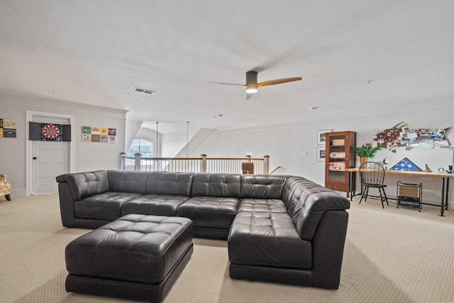 carpeted living room with ceiling fan