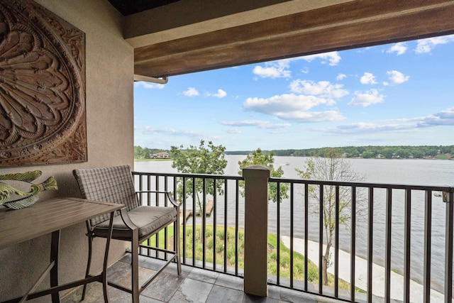 balcony featuring a water view