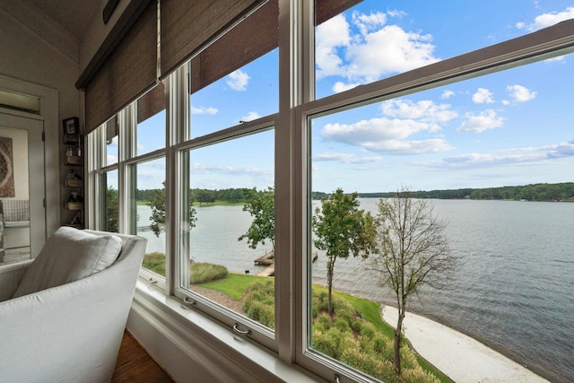 sunroom / solarium with a water view