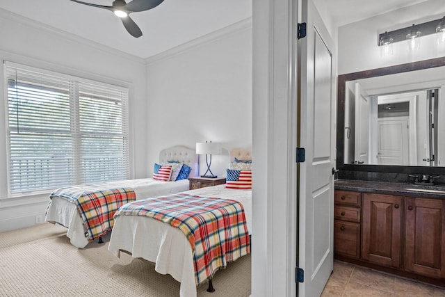 tiled bedroom with sink, crown molding, and ceiling fan