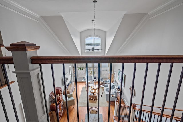 stairs featuring hardwood / wood-style flooring, lofted ceiling, and ceiling fan