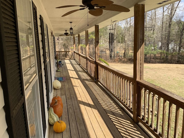 wooden deck featuring ceiling fan