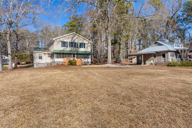 view of yard featuring covered porch