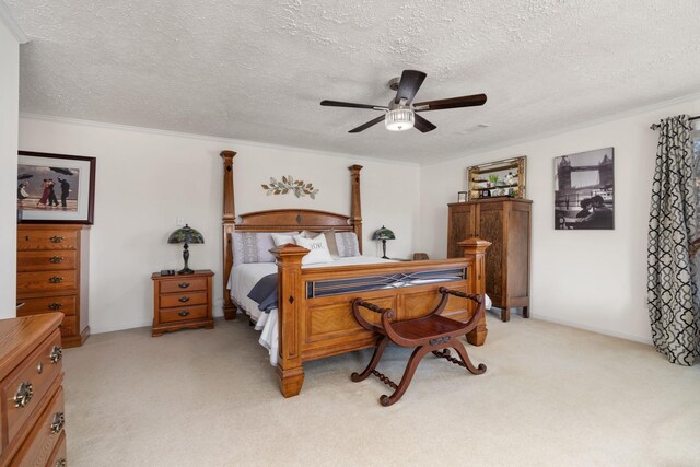 bedroom with light carpet, ceiling fan, ornamental molding, and a textured ceiling