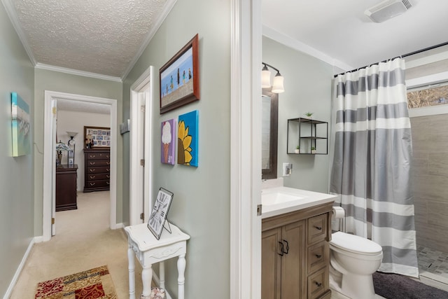 bathroom with vanity, ornamental molding, a textured ceiling, and a shower with shower curtain