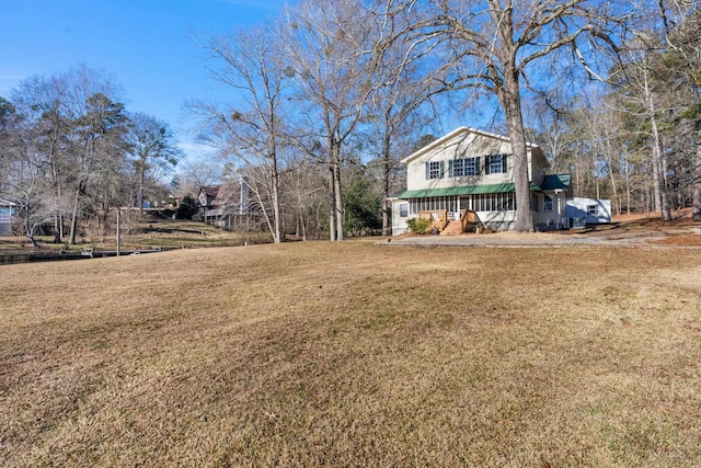 view of yard featuring covered porch