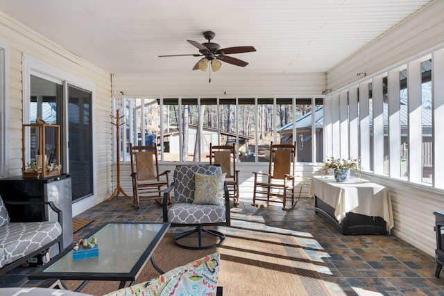 sunroom / solarium with ceiling fan