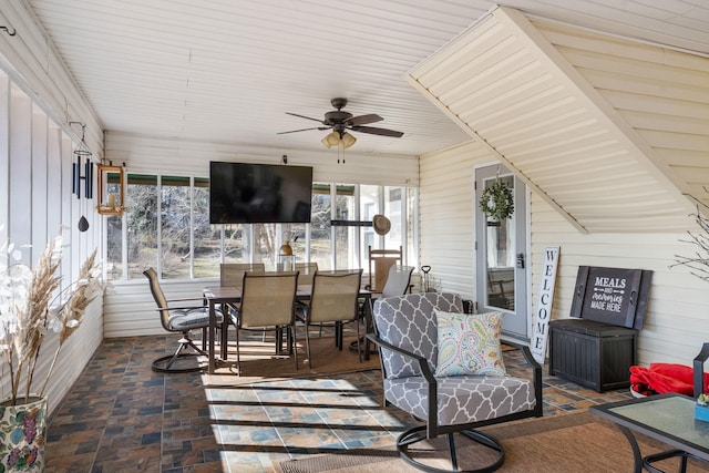 sunroom featuring ceiling fan