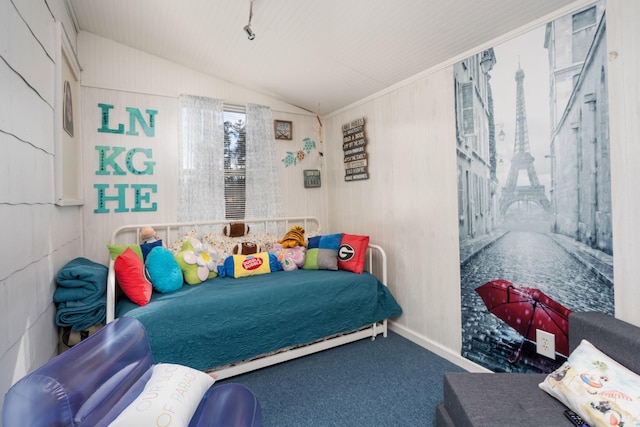 carpeted bedroom with lofted ceiling