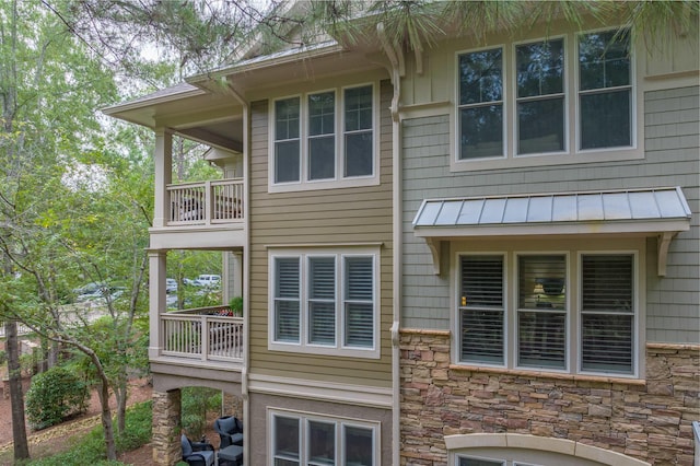 view of home's exterior with a balcony