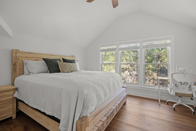 bedroom with vaulted ceiling, hardwood / wood-style floors, and ceiling fan