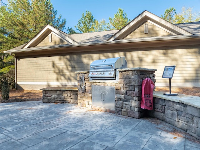 view of patio / terrace with a grill and exterior kitchen