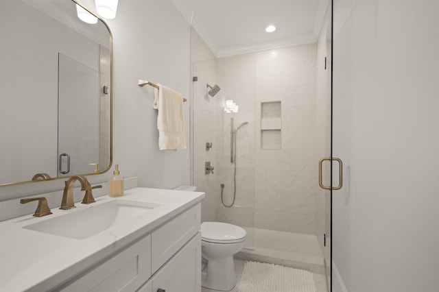 bathroom with walk in shower, ornamental molding, toilet, and vanity