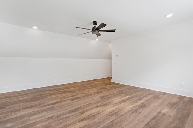 additional living space featuring ceiling fan, lofted ceiling, and light hardwood / wood-style floors