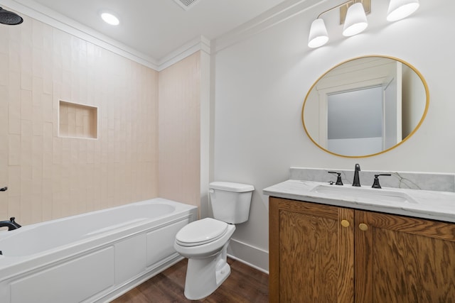 full bathroom with toilet, tiled shower / bath, vanity, ornamental molding, and hardwood / wood-style floors