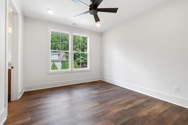 empty room with crown molding, ceiling fan, and dark hardwood / wood-style floors