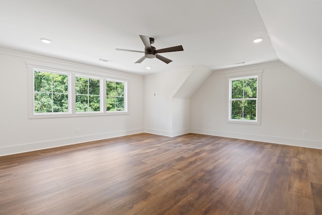 additional living space featuring vaulted ceiling, dark wood-type flooring, and ceiling fan