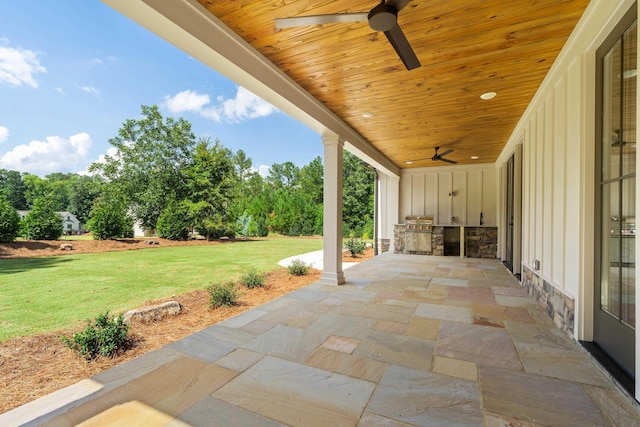 view of patio featuring area for grilling and ceiling fan