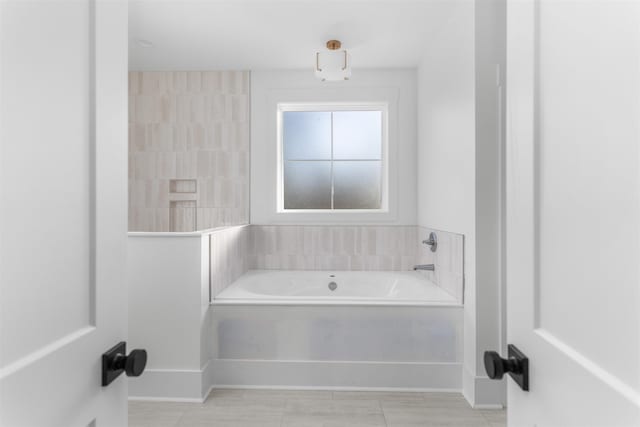 2050 Osprey Poynte, Greensboro, GA 30642 - full bath with a garden tub and baseboards