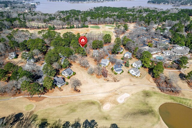 drone / aerial view featuring a water view and view of golf course