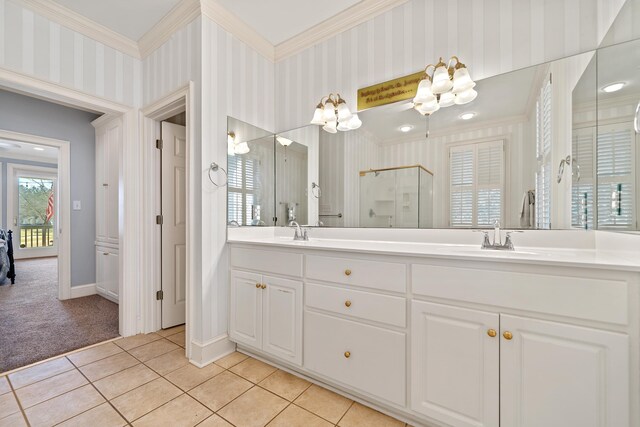 full bathroom with wallpapered walls, tile patterned floors, a stall shower, and a sink