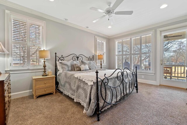 bedroom featuring access to exterior, baseboards, crown molding, and carpet