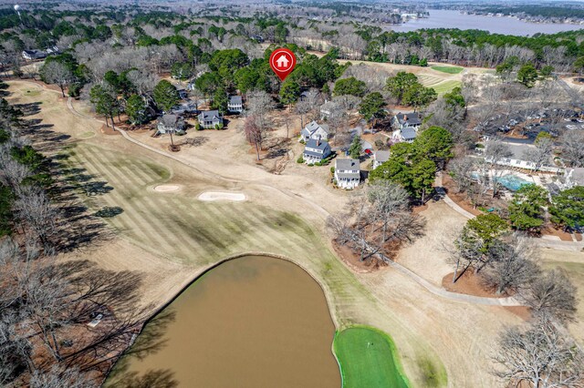 bird's eye view featuring a water view and view of golf course