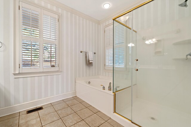 bathroom featuring tile patterned flooring, a shower stall, wallpapered walls, baseboards, and a bath