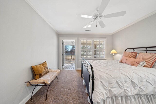 bedroom with visible vents, crown molding, baseboards, carpet floors, and a ceiling fan