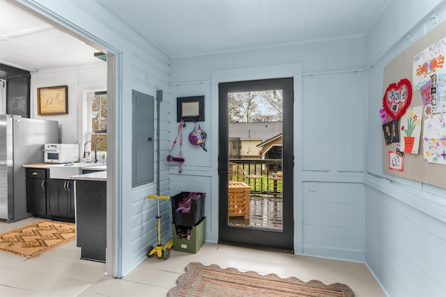 doorway to outside with a sink