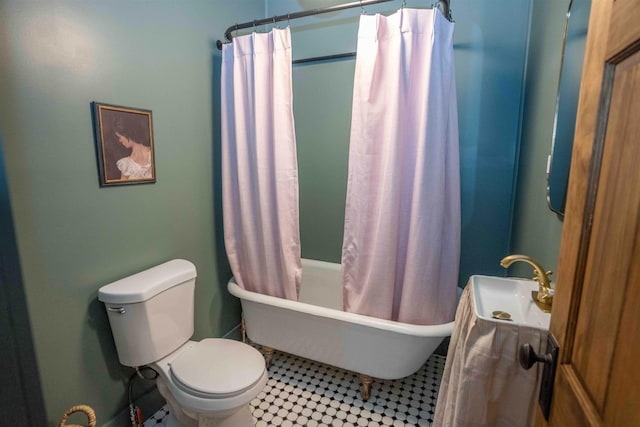 full bathroom with tile patterned floors, toilet, and shower / bathtub combination with curtain