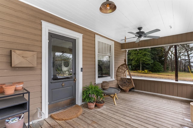 deck featuring a porch and a ceiling fan