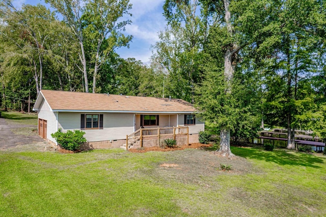 back of house featuring a lawn, crawl space, and a porch