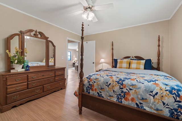 bedroom featuring ceiling fan, ornamental molding, and light wood-type flooring
